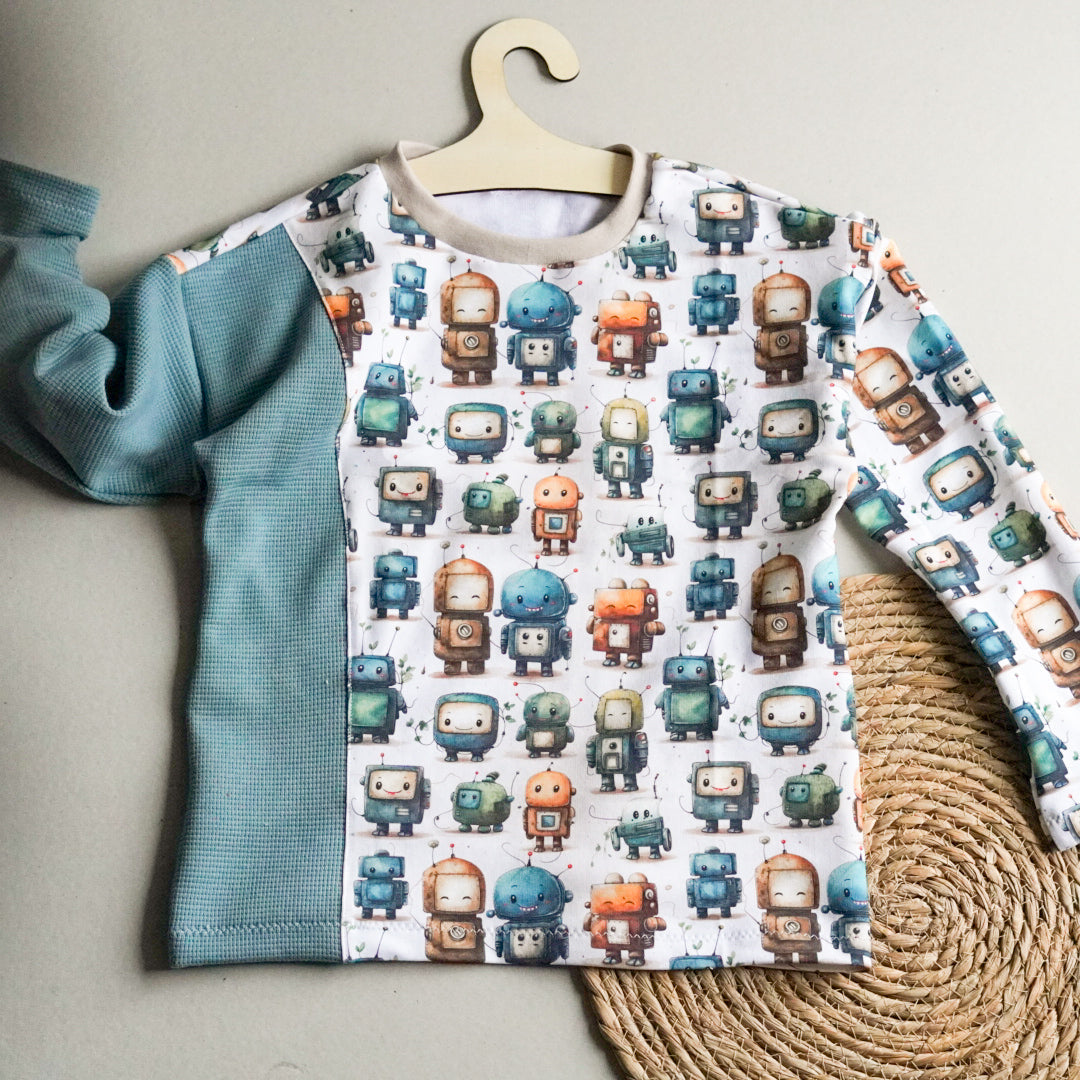 Kinderstoff Meterware vintage roboter Meterware Jungenstoff als Kinderpullover genäht